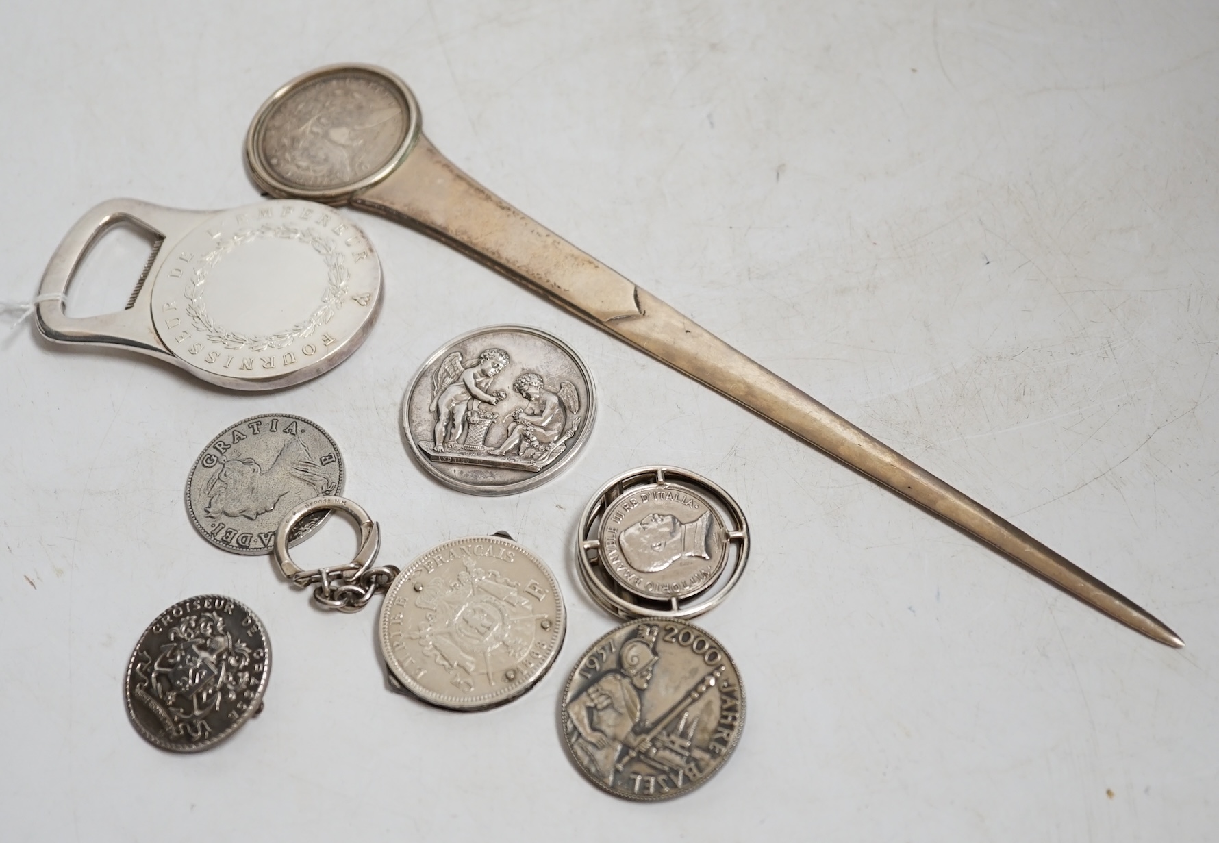 A group of mostly silver coins and a Cristofle silver plated bottle opener. Condition - fair